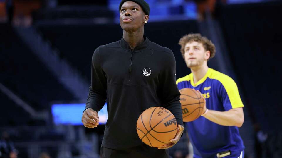 Golden State Warriors’ Dennis Schröder and Brandin Podziemski warm up before playing Utah Jazz during NBA game at Chase Center in San Francisco on Tuesday, January 28, 2025.