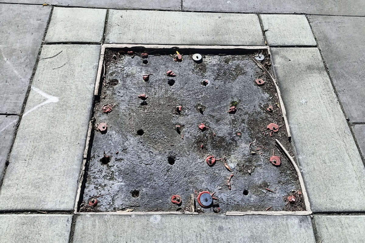 Brass plaques were ripped out of the sidewalk in Oakland,