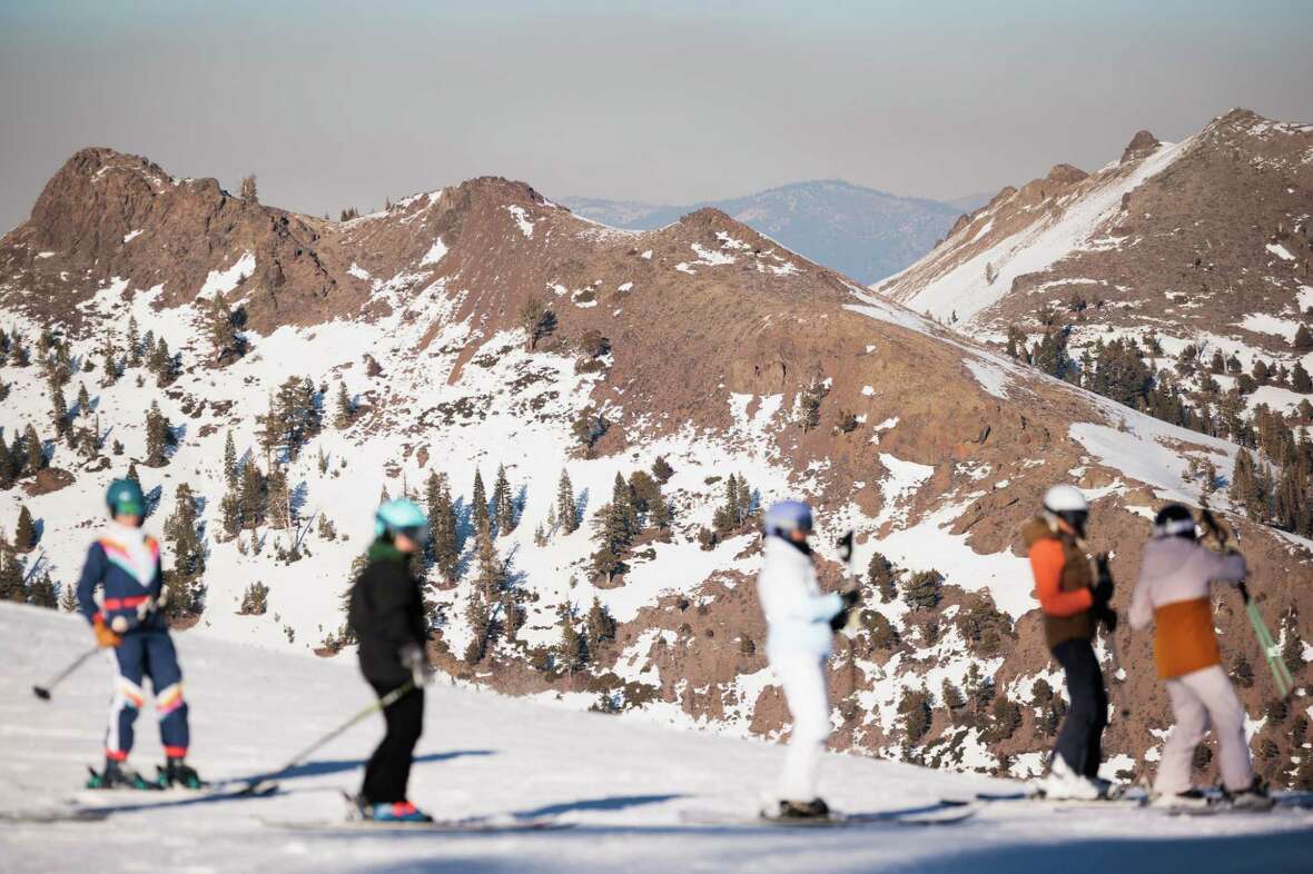 While most runs at Palisades Tahoe have adequate snow coverage, nearby south-facing slopes are dry in Olympic Valley, Wednesday, January 29, 2025. Despite a dry January, most of Palisades Tahoe has snow covered runs.