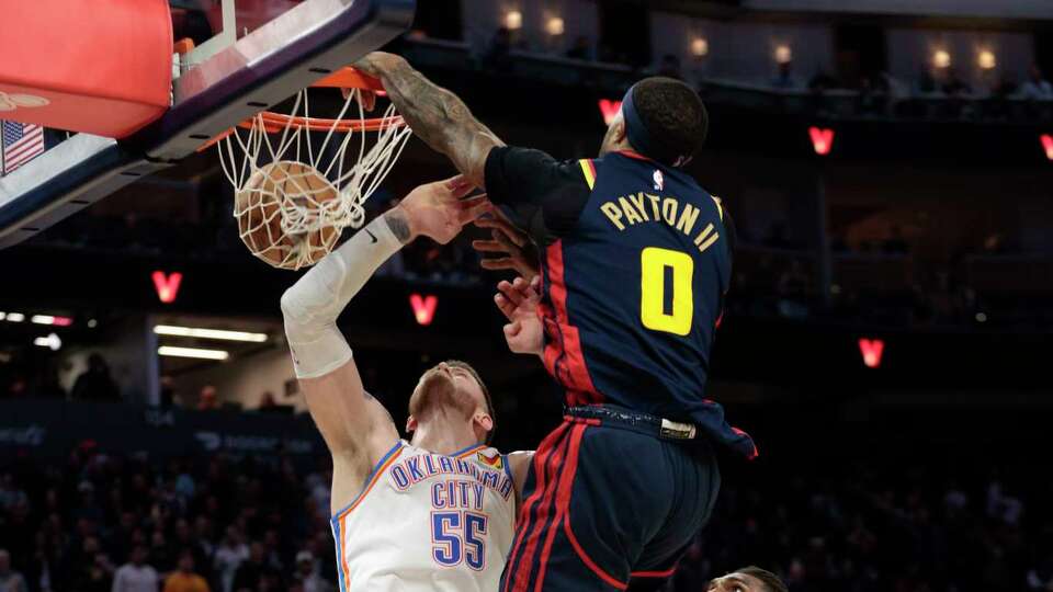 Golden State Warriors guard Gary Payton II (0) dunks against Oklahoma City Thunder center Isaiah Hartenstein (55) in the fourth quarter during an NBA game at Chase Center in San Francisco, Wednesday, Jan. 29, 2025. The Warriors won 116-109.