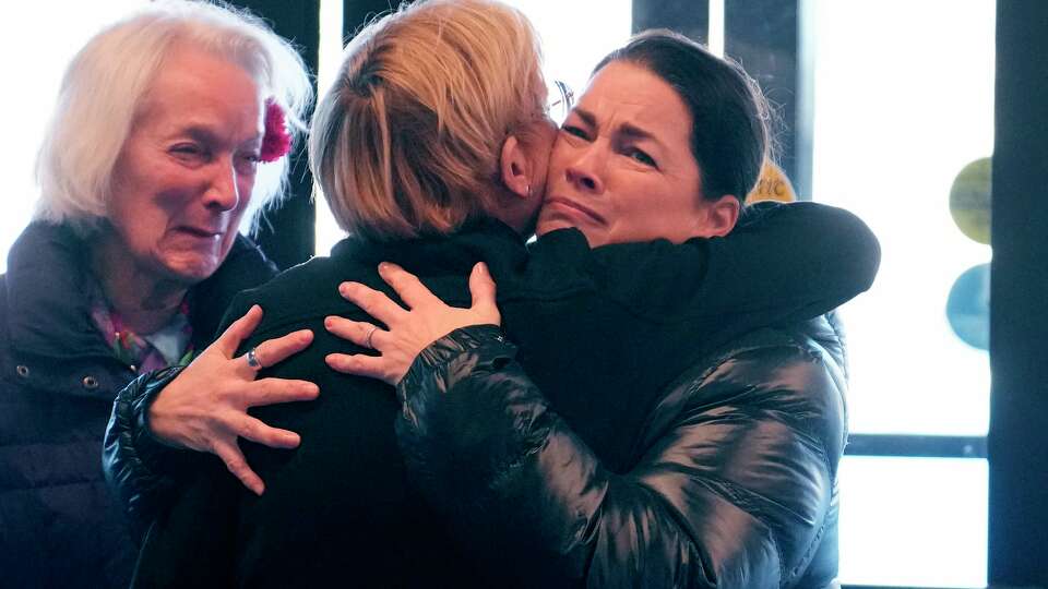 Former Olympic skater Nancy Kerrigan, right, is embraced while arriving at The Skating Club of Boston with fellow Olympic skater Tenley Albright, left, Thursday, Jan. 30, 2025, in Norwood, Mass.