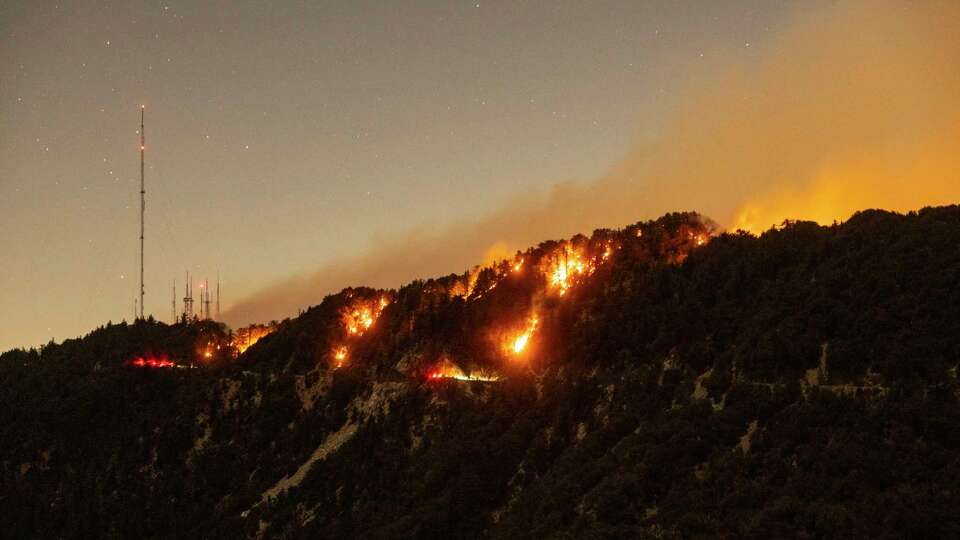 Spots of the Eaton Fire still burn after the fire swept through the mountains of the Angeles National Forest near Mount Wilson Observatory, north of Pasadena, Thursday, Jan. 9, 2025. (AP Photo/Etienne Laurent)