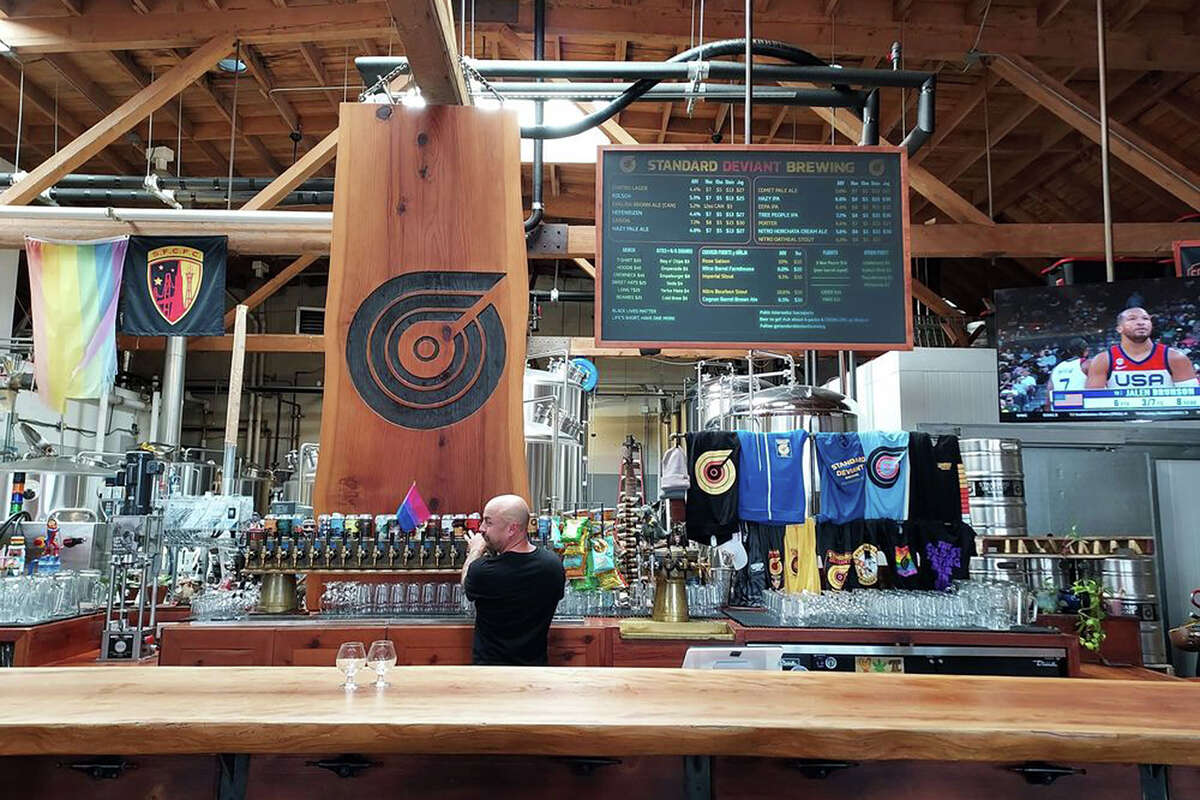 Standard Deviant owner Mark DeVito pours a beer at the brewery and taproom, which is located at 280 14th St.