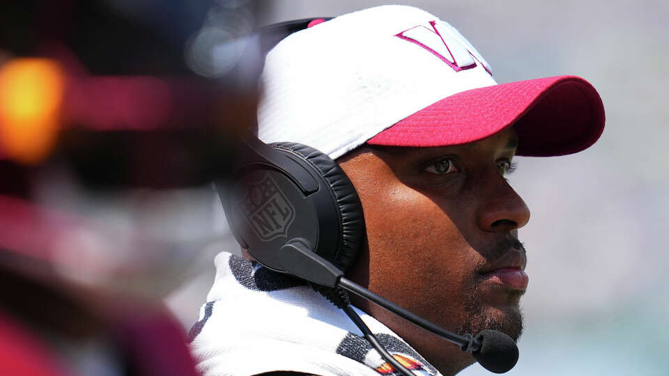 Assistant head coach and offensive passing game coordinator Brian Johnson of the Washington Commanders looks on against the New York Jets in the second half of the preseason game at MetLife Stadium on August 10, 2024 in East Rutherford, New Jersey.