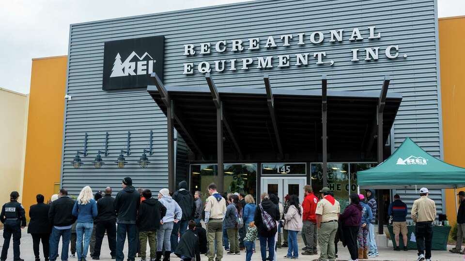 People gather at the REI store in Marina, Calif., Sunday, Jan. 26, 2025.