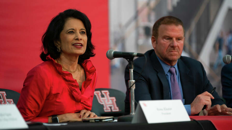 University of Houston President Renu Khator speaks next to board of regents chairman Tilman Fertitta at the University of Houston College of Medicine on Wednesday, Nov. 3, 2021. 