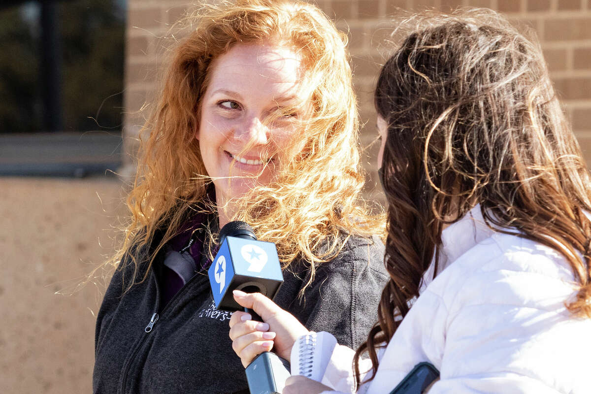 Jenny Cudd, left, a flower shop owner and former Midland mayoral candidate, leaves the federal courthouse in Midland, Texas, Wednesday, Jan. 13, 2021. The FBI arrested Cudd and Eliel Rosa on Wednesday in connection with the Jan. 6 insurrection at the U.S Capitol. (Jacob Ford/Odessa American via AP)