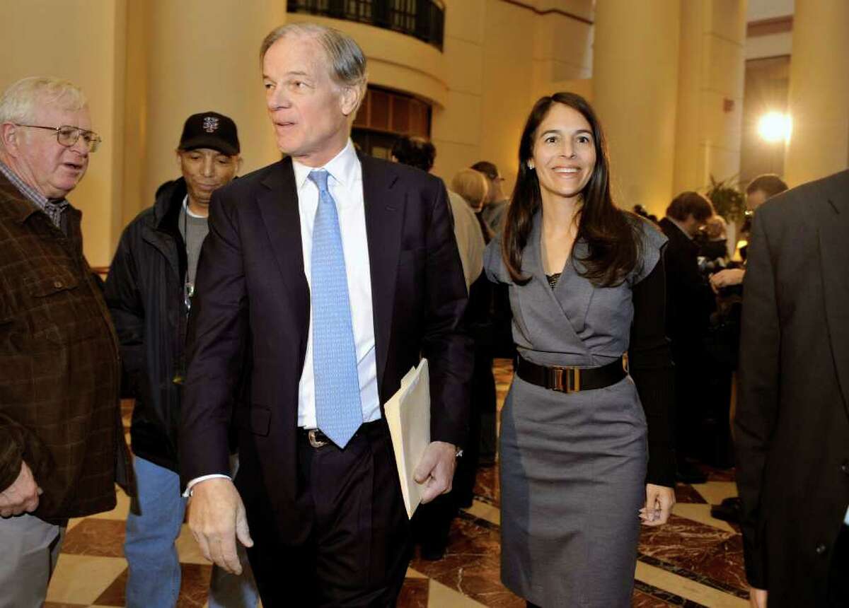 Tom Foley, the Republican candidate for governor of Connecticut, leaves a news conference with wife Leslie after conceding in the governor's race to Democrat Dan Malloy in Hartford, Conn., Mon, Nov. 8, 2010. (AP Photo/Jessica Hill)