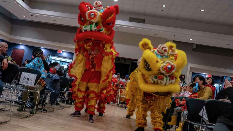 Members of the Toishan Benevolent Association perform the Lion Dance at the combined Lunar New Year and Black History Month celebration at the Oakland Asian Cultural Center, Saturday, Feb. 1, 2025.