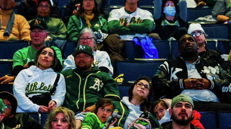 Oakland A’s fans watch a screen during Oakland A’s great Rickey Henderson’s Celebration of Life Ceremony as it’s held at the Oakland Arena in Oakland, Calif. on Saturday, February 1, 2025. Henderson transitioned in December at the age of 65.