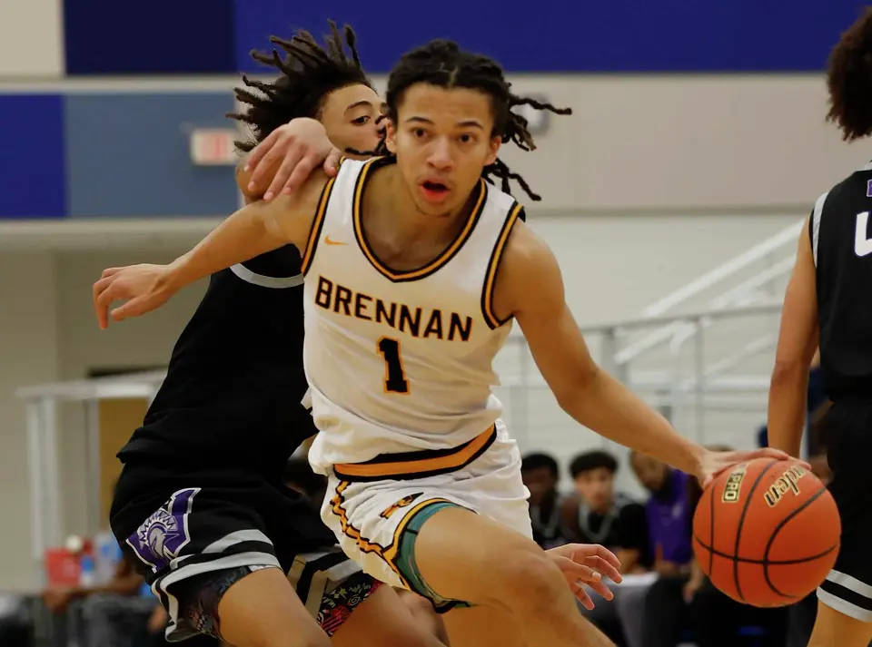 Brennan Bears Kingston Flemings (1) drives against Warren In the second half for game between Brennan Warren at Harlan HS on Wednesday, Feb. 12,2025