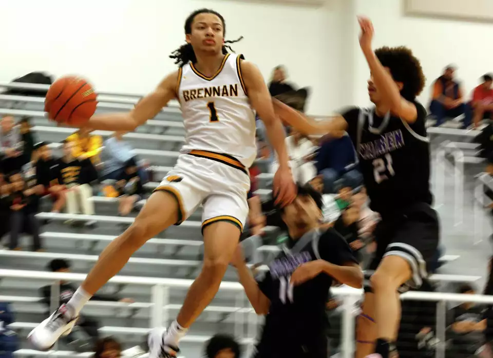 Brennan Bears Kingston Flemings (1) drives for two against Warren In the first half for game between Brennan Warren at Harlan HS on Wednesday, Feb. 12,2025