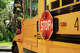 A close up of a yellow school bus.