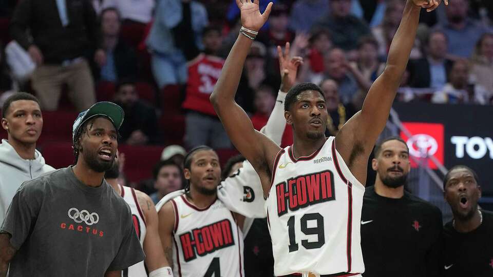 Houston Rockets bench reacts as Nate Williams (19) watches his three-point shot go in against the Golden State Warriors at the Toyota Center on Thursday, Feb. 13, 2025 in Houston. Golden State Warriors won the game 105-98.