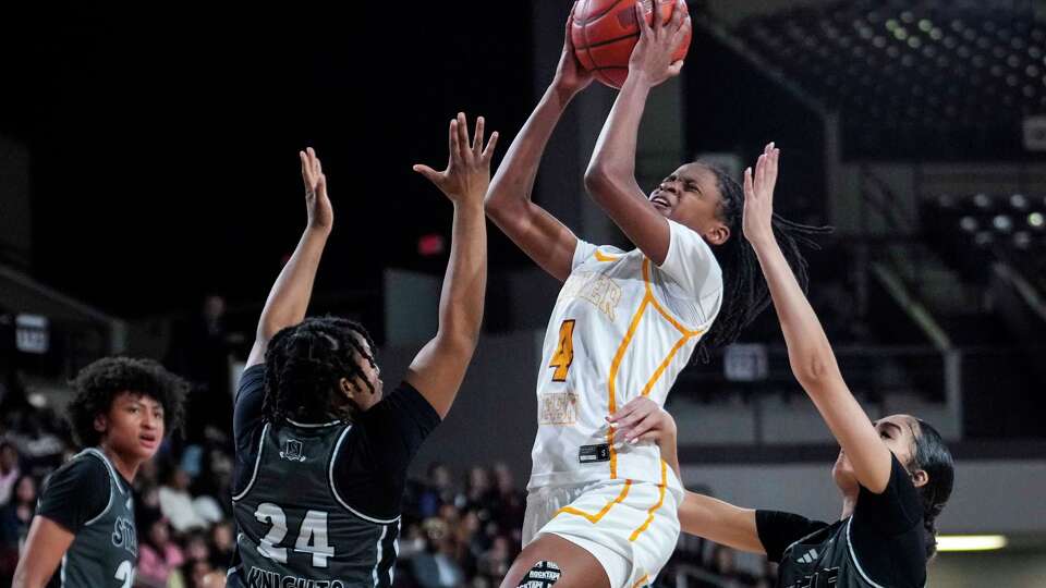 Summer Creek guard Kennedy Simpson (4) shoots over Cibolo Steele forward Michaile Todd (24) during the first half of a Class 6A Division 1 UIL State semifinal girls basketball game on Tuesday, Feb. 25, 2025 in Houston.