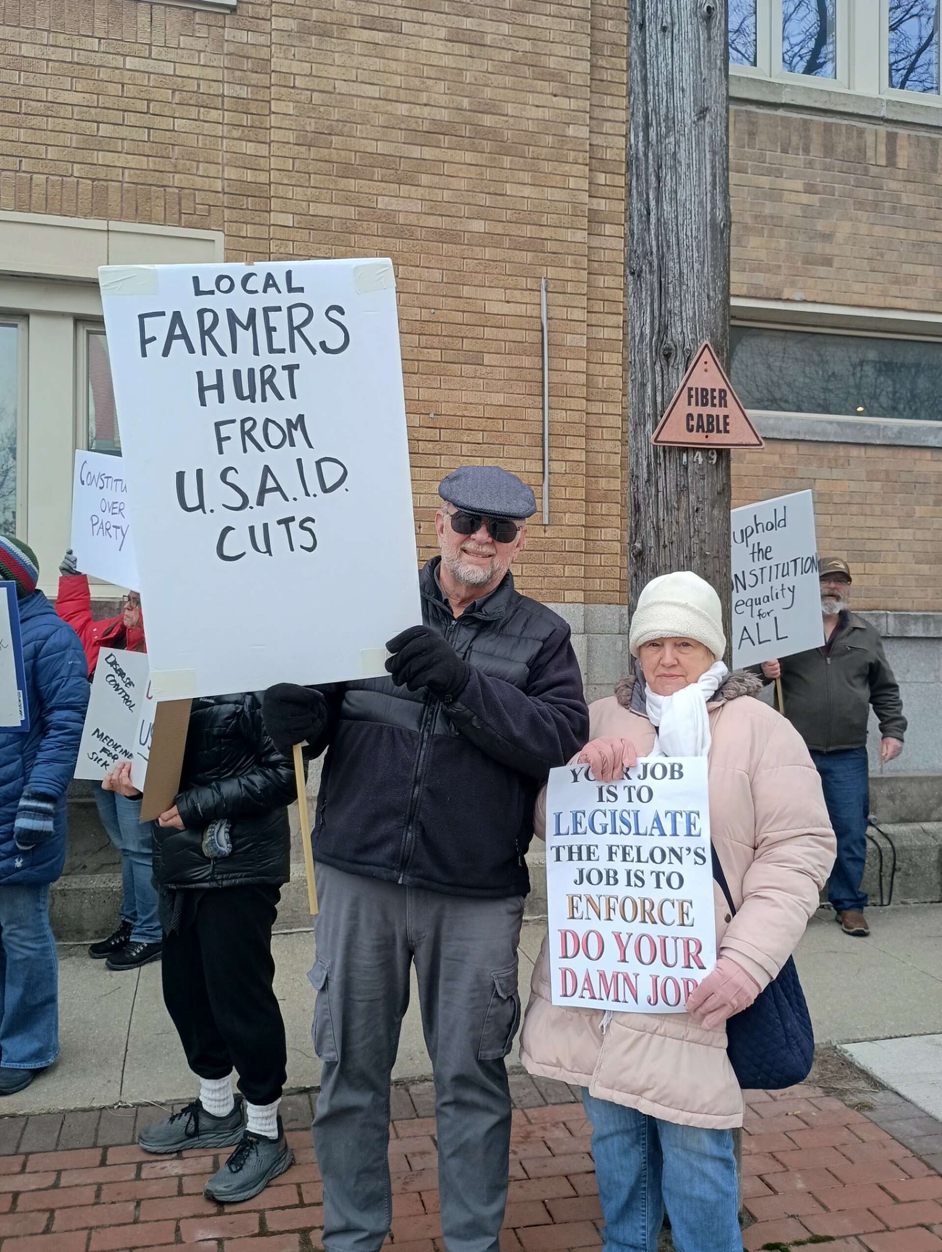 Protesters gather at Rep. Moolenaar's Clare office to demand answers