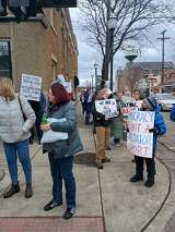 Protesters gather at Rep. Moolenaar's Clare office to demand answers