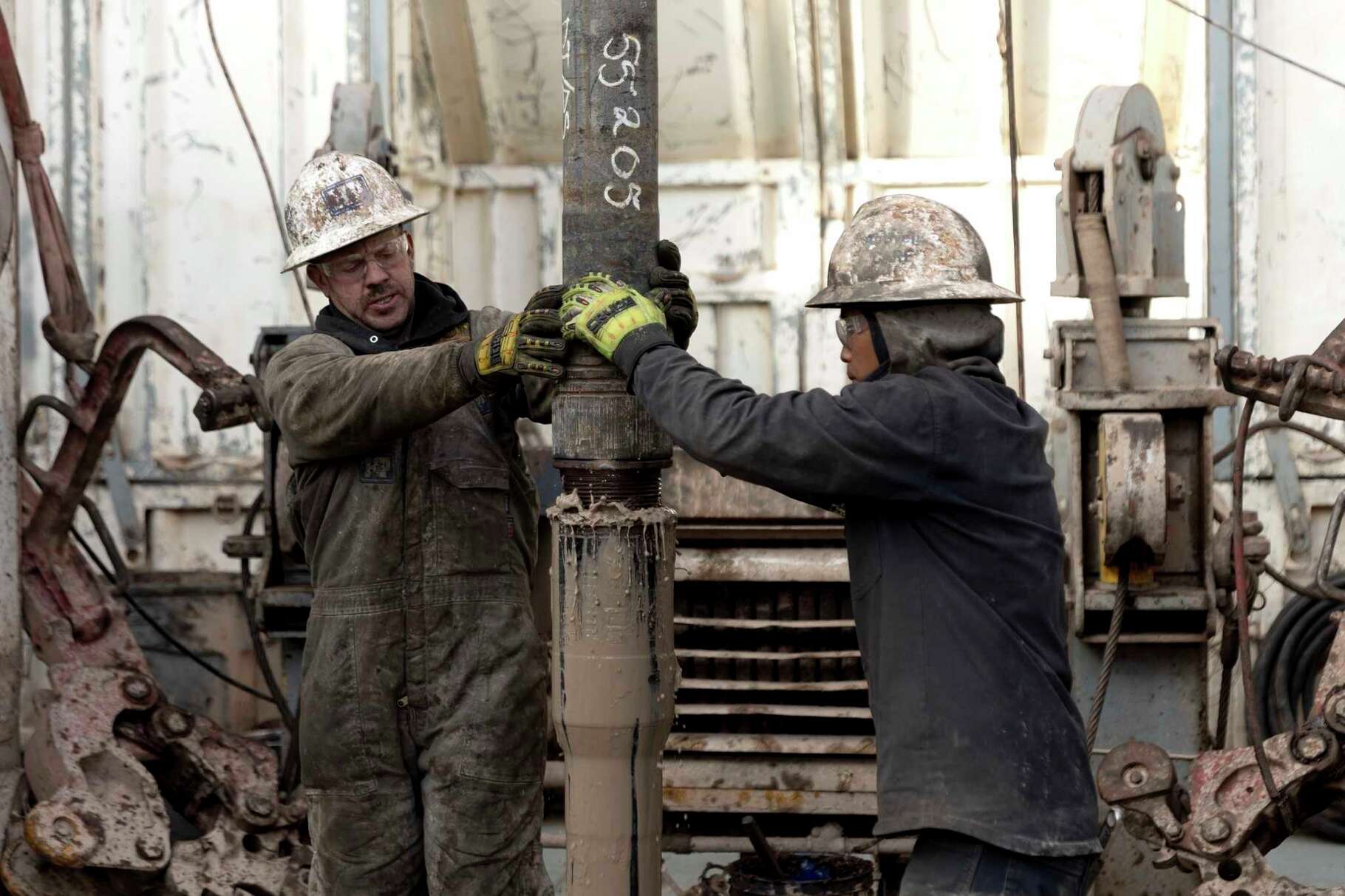 Rig operators connect drills that will plunge underground to access heat reservoirs on Sunday, Nov. 26, 2023, near Milford, Utah. In Nevada, Fervo Energy's first operational project has begun pumping carbon-free electricity onto that state's electric grid to power Google data centers, Google announced Tuesday, Nov. 28. That pilot will help Fervo launch projects like this one in Utah to deliver far more carbon-free electricity to the grid. (AP Photo/Ellen Schmidt)