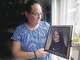 Beverly Canfield of Lebanon shows a picture of her sister Louisa Scott, who was strangled to death in1980 in Coventry by Edward F. Boyle Jr. Boyle was driving a pickup truck that was involved in a fatal accident Monday night in Voluntown.