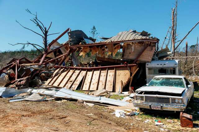 Residents pick up the pieces after devastating storms scour the US ...