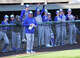 Marquette players and head coach Tim Fahnestock watch the final out of their 4-3 season-opening win over Gillespie at Lloyd Hopkins Field.