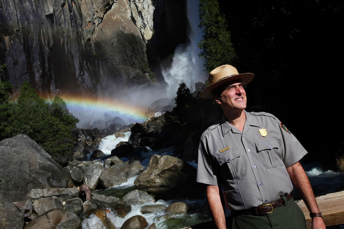 FILE: Scott Gediman, a Yosemite Superintendent, listens to a tourists question as he stands near Lower Yosemite Fall.