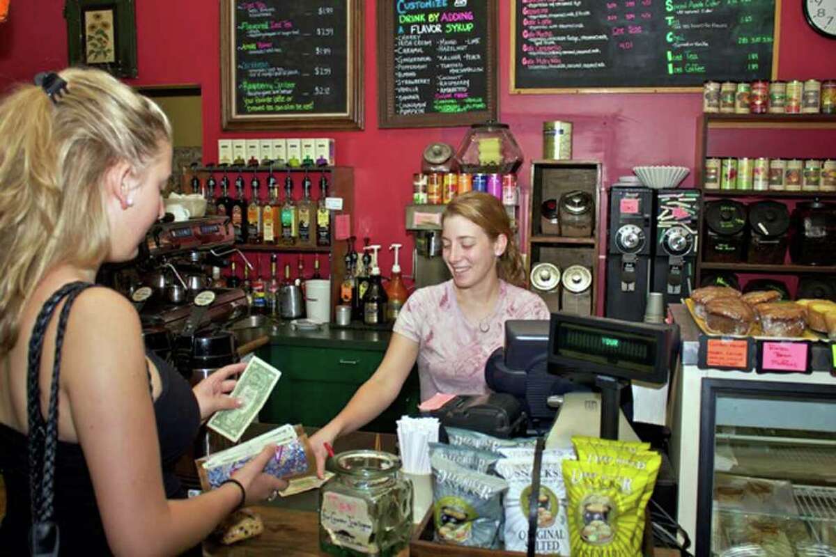 The Bank Street Coffee House has new owners, but it looks much the same as it did in this September photo, in which Ramona Borz, left, bought coffeee from Shannon Gallagher.