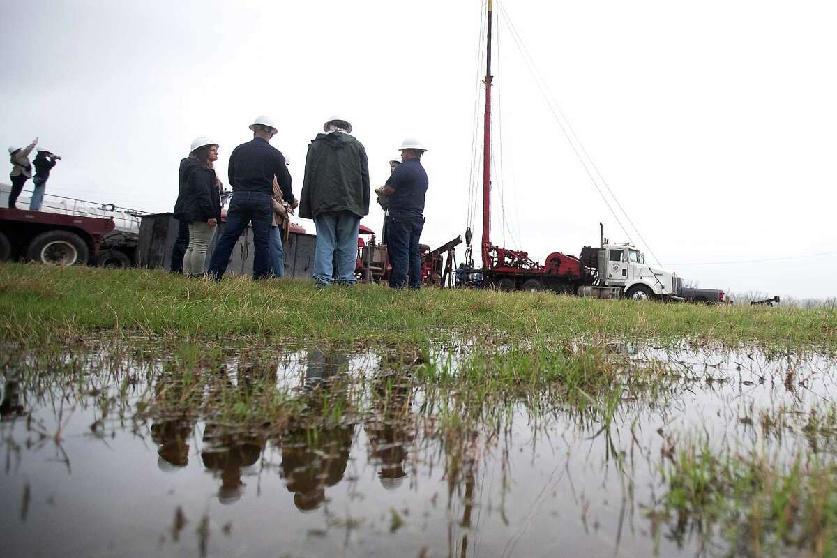 Members of the Railroad Commsion of Texas and the media view the plugging of an orphan well in Luling on Thursday, March 27, 2025.