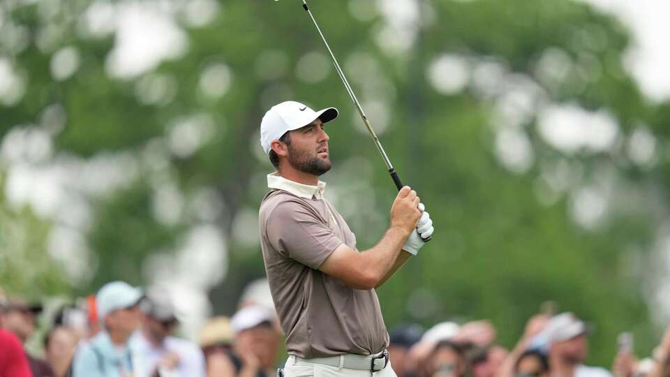 Scottie Scheffler hits from the second tee during the final round of the Houston Open golf tournament in Houston, Sunday, March 30, 2025. (AP Photo/Ashley Landis)