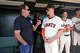 J.T. Snow, Barry Bonds and Matt Chapman of the San Francisco Giants chat in the dugout before the team’s game at Oracle Park on April 4, 2025, in San Francisco.