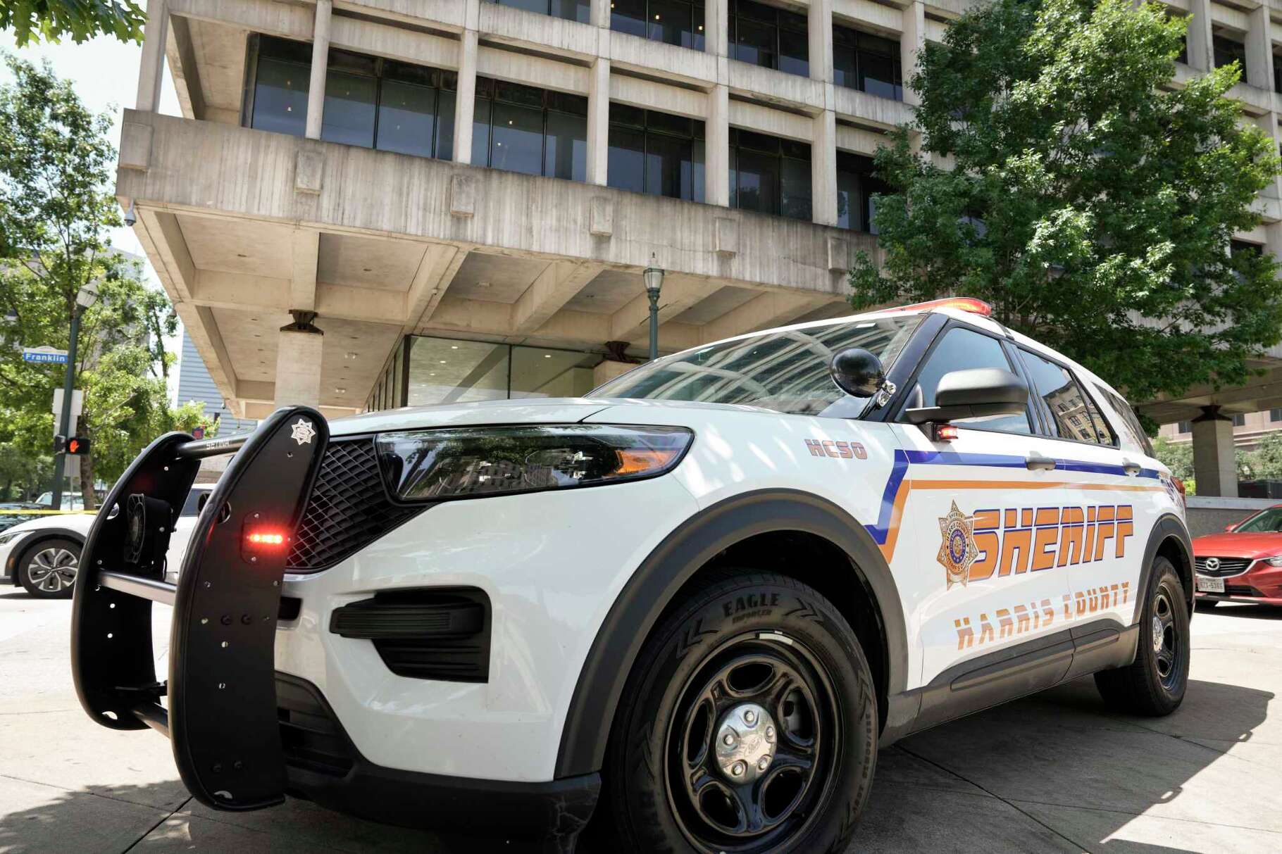 Large law enforcement presence are outside the family courthouse at San Jacinto and Franklin after a Harris County sheriff’s deputy was shot, as was the suspected shooter, in Houston, Monday, April 21, 2025.