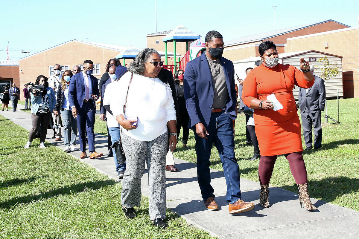 Bruce Elementary Principal Shawn Nickerson, from right, talks with EPA Administrator Michael S. Regan and HISD Secretary Katy Blueford-Daniels at the school in Houston on Friday, Nov. 19, 2021. Administrator Regan’s stop was part of a week-long trip through Mississippi, Louisiana and Texas to highlight environmental justice concerns, hear from impacted communities and discuss solutions for communities most in need.
