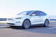 The Tesla Model X is a three-row electric SUV famous for its falcon-wing doors and available used at bargain prices.