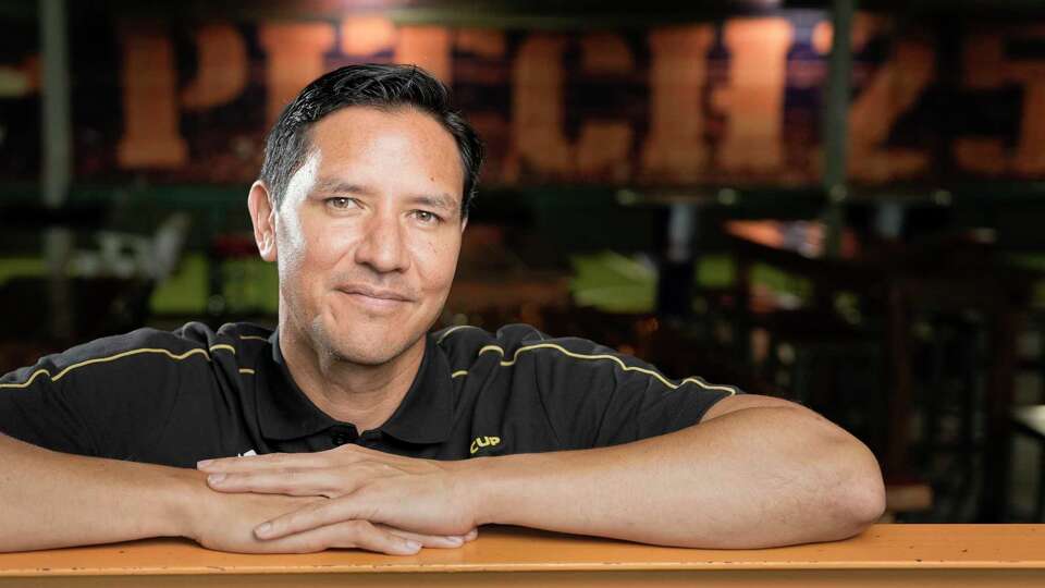 Brian Ching, owner of Pitch 25 and former Houston Dynamo and US national team soccer player, poses for a photograph at Pitch 25 in Houston, Tuesday, May 6, 2025. Pitch 25, Houston's biggest soccer bar, will be in the middle of the World Cup Fan Festival in EaDo next summer.