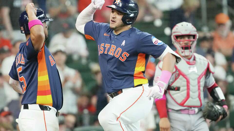 Houston Astros catcher Yainer Diaz (21) celebrates as he touches home plate after connecting for a three-run home run in the bottom of the third inning against the Cincinnati Reds at Daikin Park in Houston on Sunday, May 11, 2025.