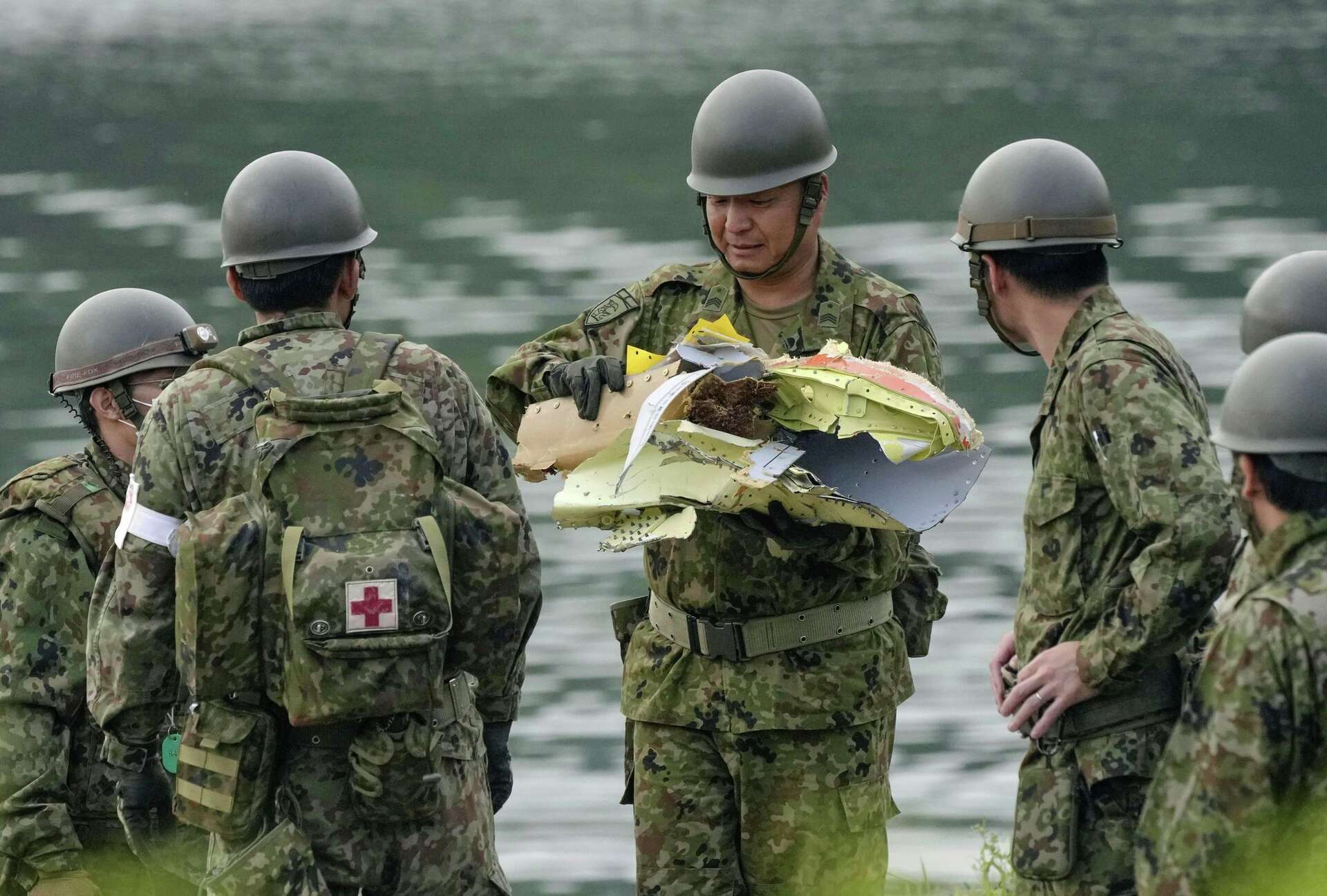 Japan starts emergency inspections on nearly 200 military training planes after crash