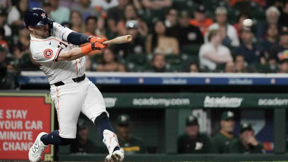 Houston Astros Chas McCormick (20) hits an RBI double off Athletics starting pitcher JP Sears during the second inning of an MLB baseball game in Houston, Tuesday, May 27, 2025.