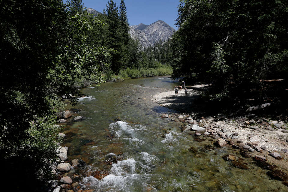 Woman swept away in California river while trying to save sister