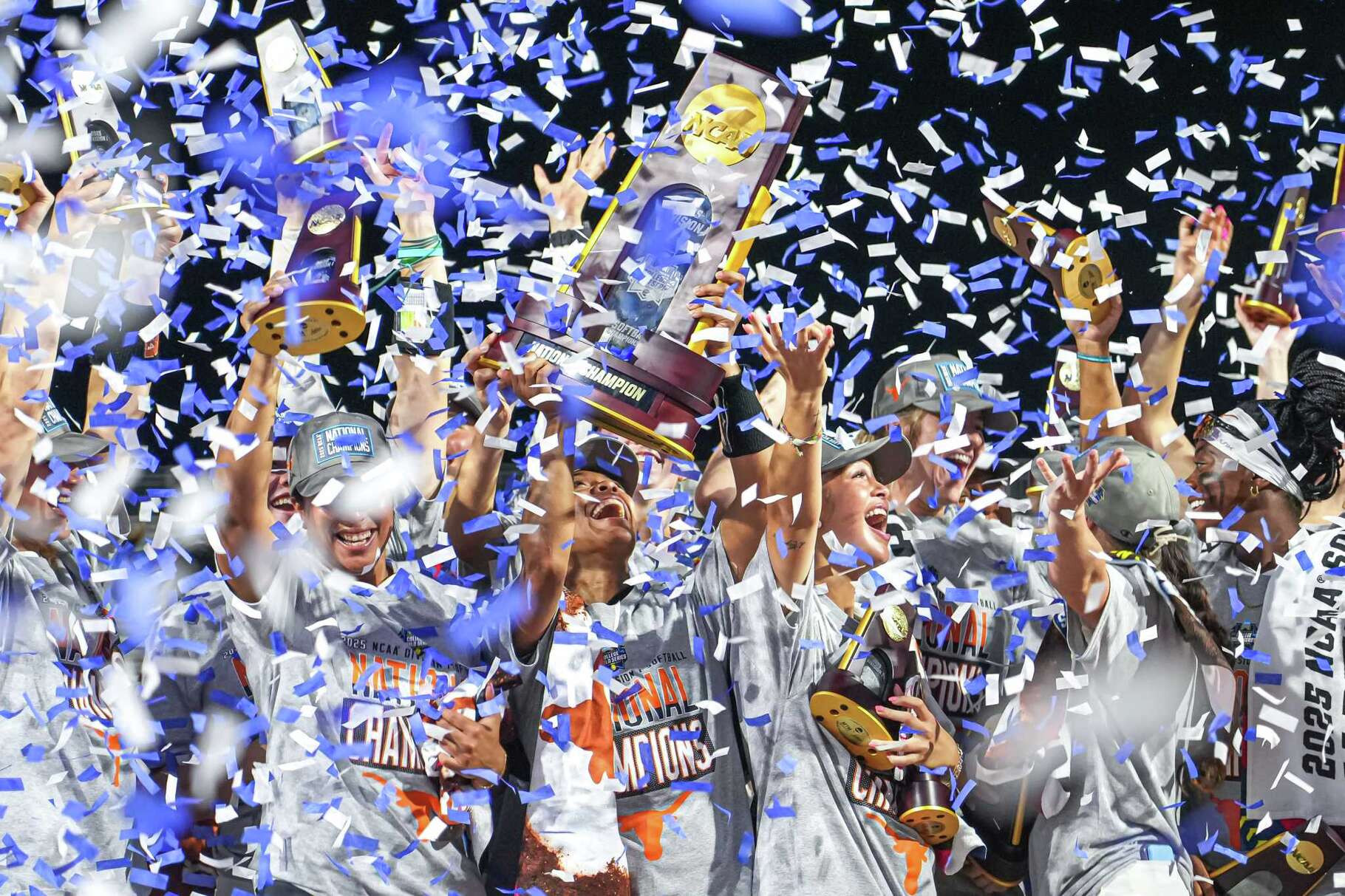 Texas Longhorns outfielder Kayden Henry (21) and the team hoist the national championship trophy after the 10-4 win over Texas Tech in game three of the NCAA Women’s College World Series at Devon Park on Friday, June 6, 2025 in Oklahoma City, Oklahoma.