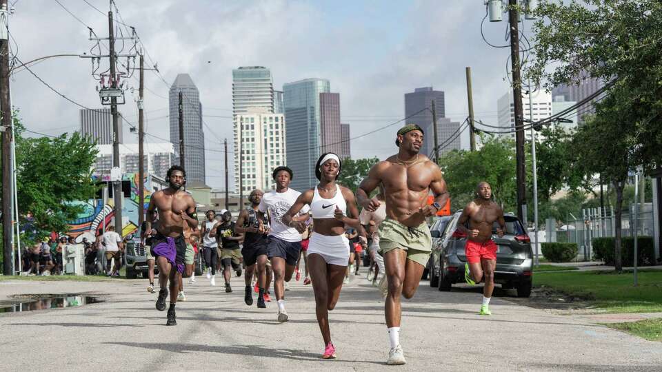 People running with ZFT Houston Run Club are photographed on Saturday, June 7, 2025 in Houston.