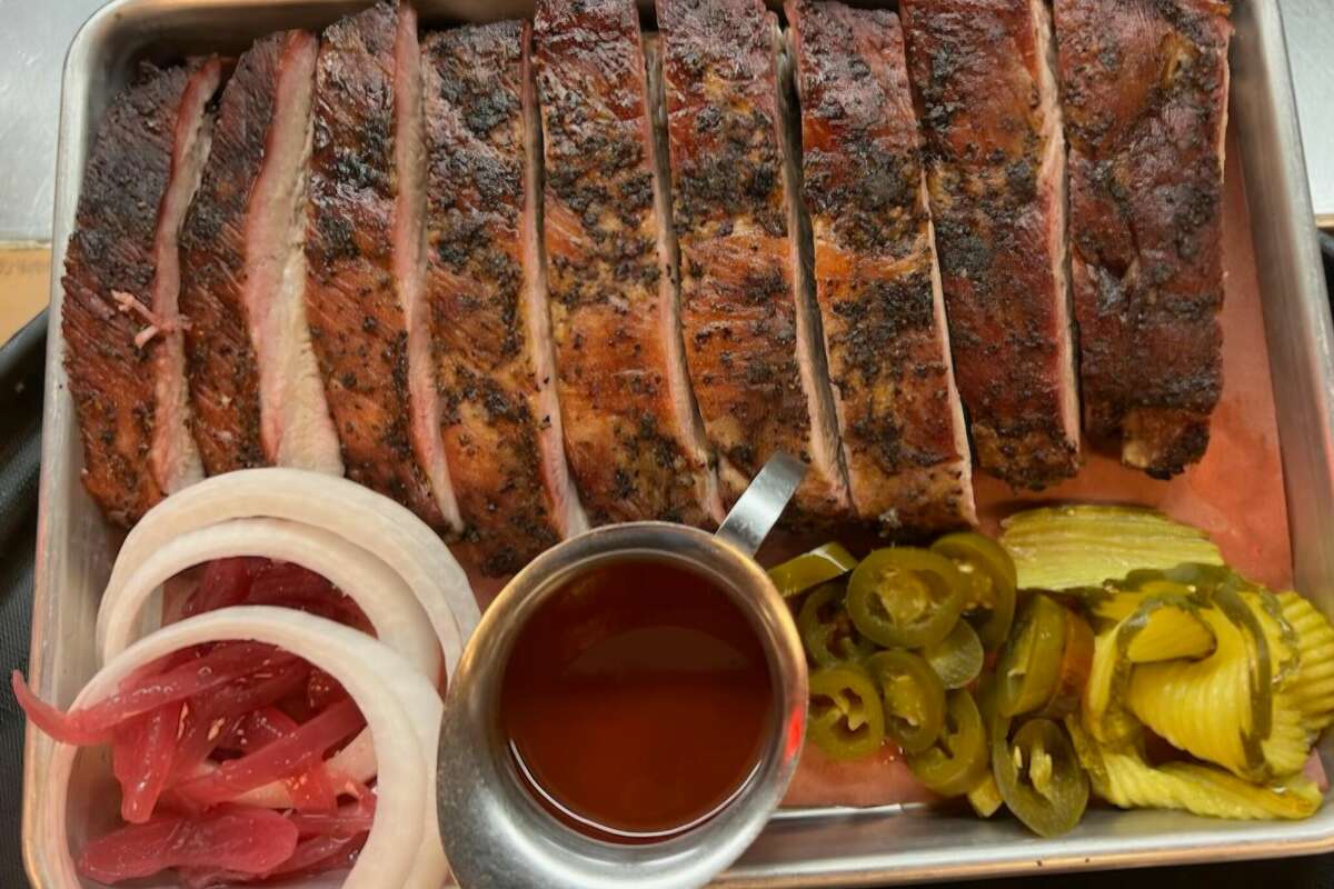 A plate of pork spare ribs from Pizzitola's Heritage BBQ in Houston, Texas. It's one of the most iconic barbecue items in the city.