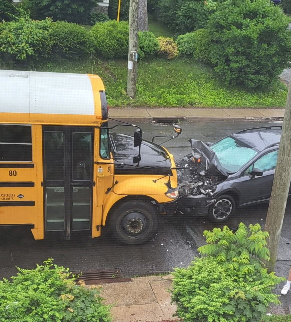 Driver injured after hitting school bus in Waterbury, police say