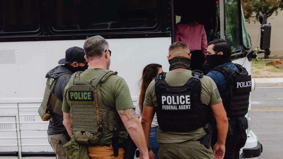 Immigration and Customs Enforcement (ICE) and other federal law enforcement agents detain and escort two immigrant women from the federal immigration courts in San Antonio on Tues, Jun 10, 2025.