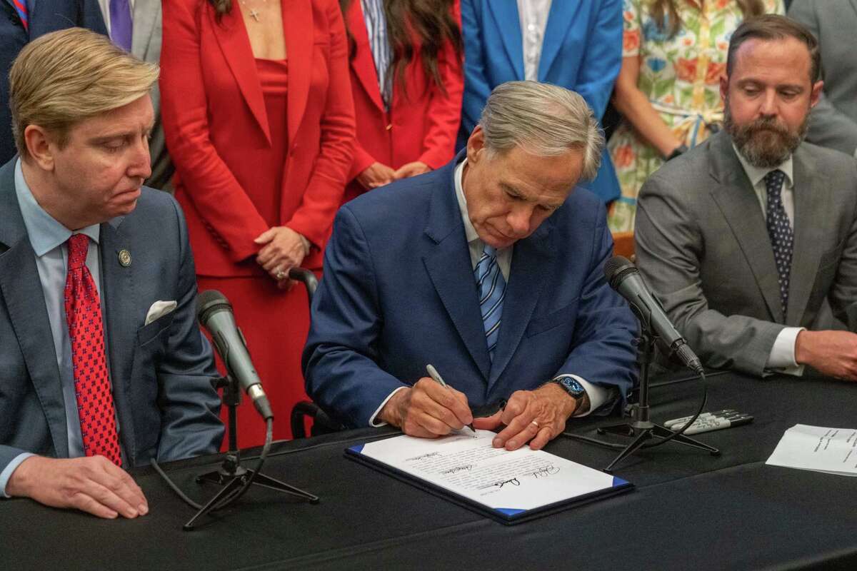 Gov. Greg Abbott signs legislation that will provide a $50 million state investment to initiate clinical trials for ibogaine, a natural psychedelic extract from an African plant that advocates say can be a safe and effective alternative to opioids for the treatment of PTSD and opioid use disorder, at the Texas Capitol Wednesday, June 11, 2025.