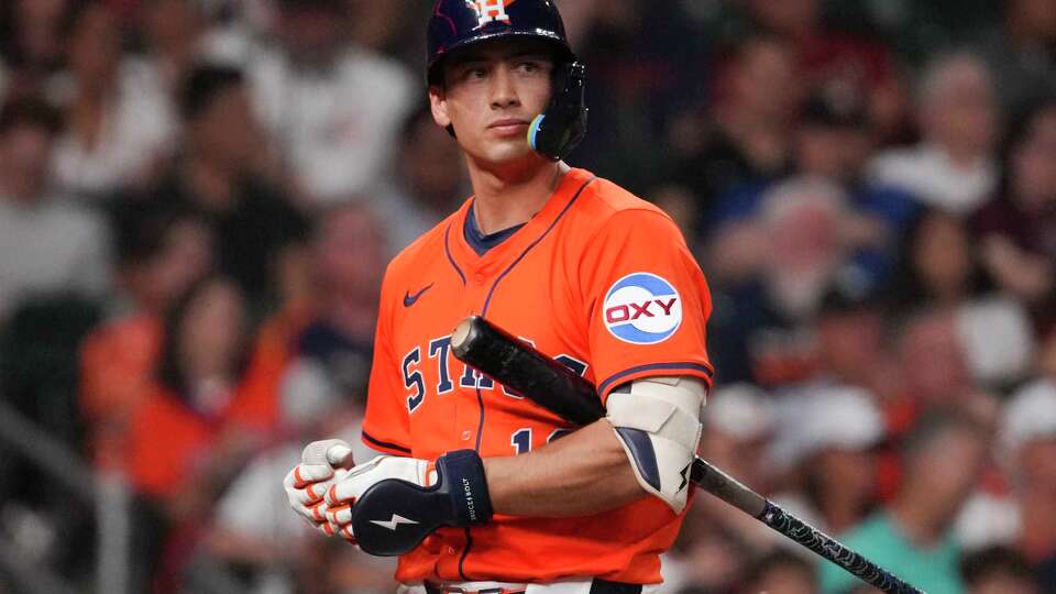 Houston Astros Shay Whitcomb (10) walks back to the dugout after striking out in the seventh inning of an MLB baseball game in Houston, Friday, June 13, 2025.