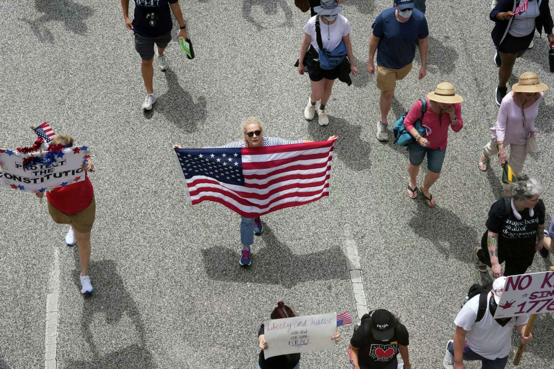 People march through downtown Houston for the 'No Kings' nationwide protest against President Donald Trump, ICE and the military parade on Saturday, June 14, 2025.