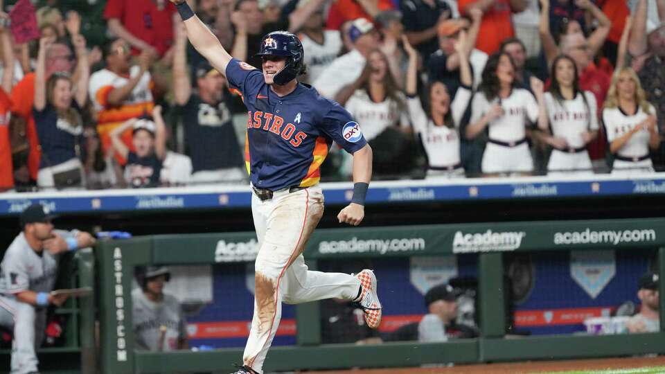Houston Astros outfielder Jake Meyers (6) scores off of a single by Houston Astros second base Mauricio Dubón (14) in the 10th inning at Daikin Park in Houston on Sunday, June 15, 2025. Houston Astros defeated Minnesota Twins 2-1 in 10 innings.