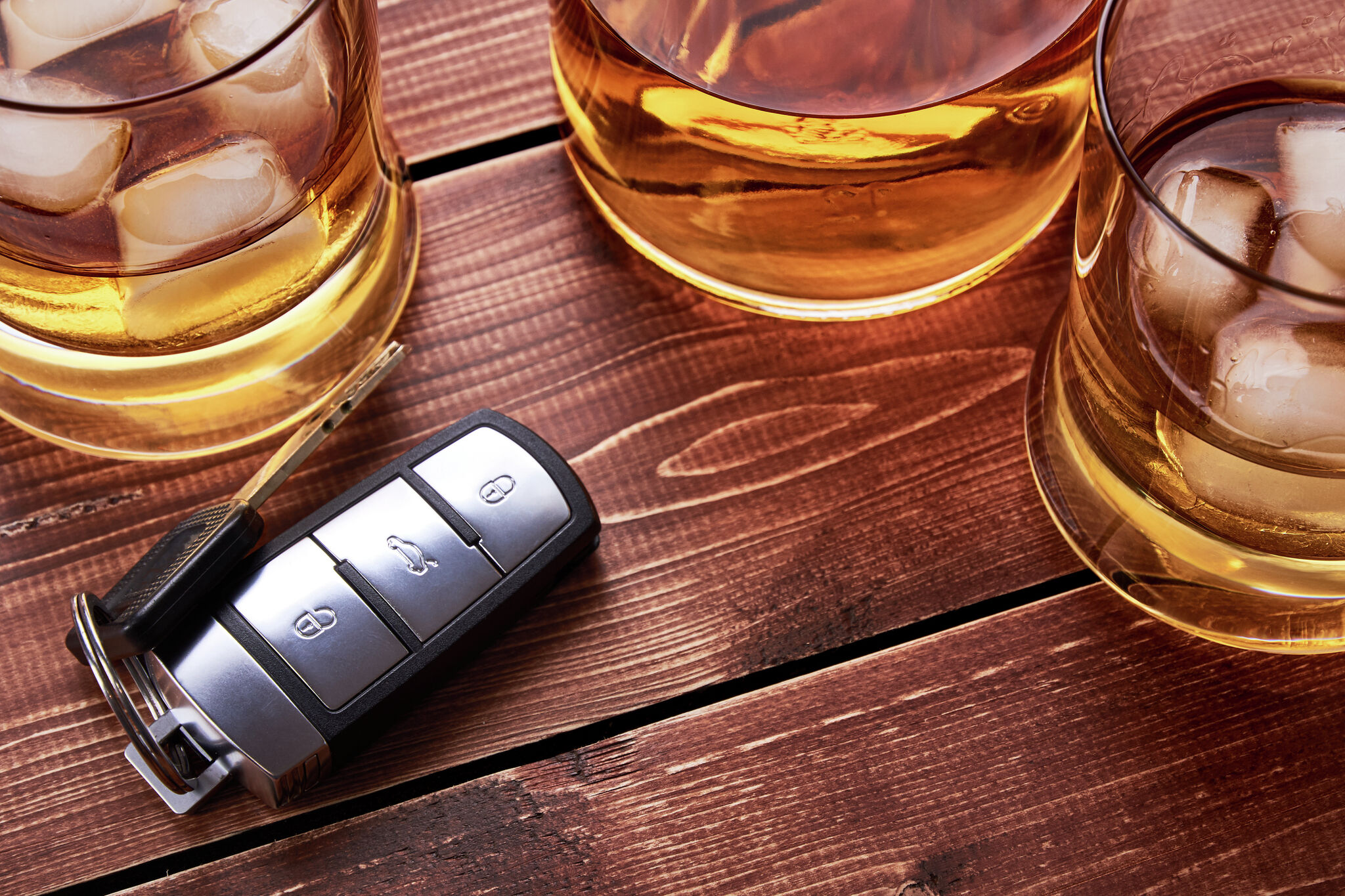 Man arrested for DWI after being found passed out in car, police say