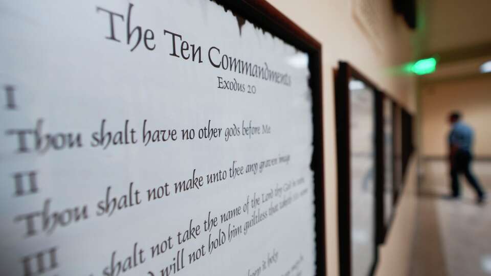FILE - A copy of the Ten Commandments is posted along with other historical documents in a hallway at the Georgia Capitol on June 20, 2024, in Atlanta.