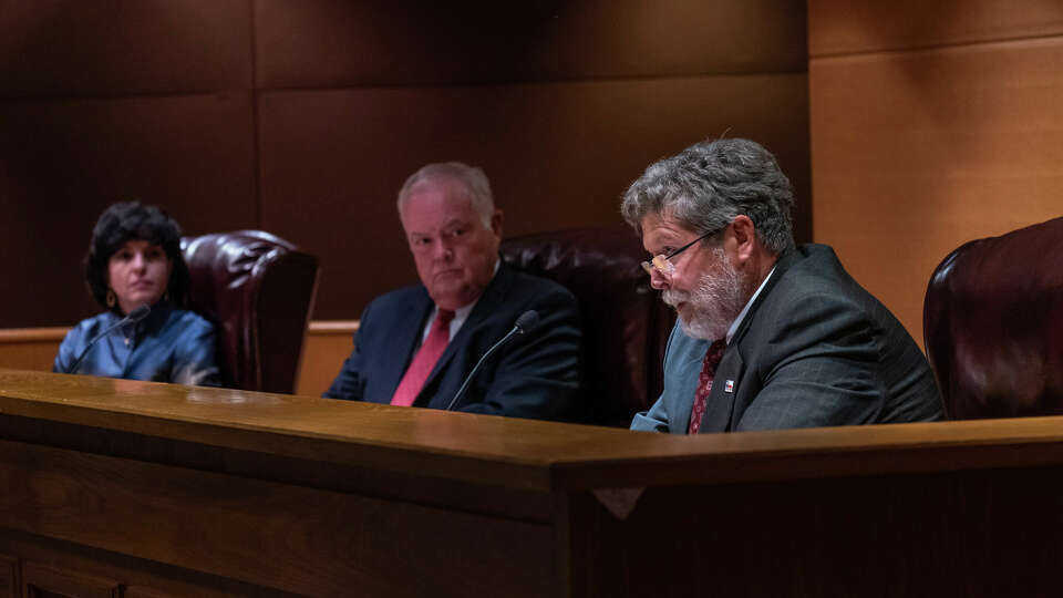 Railroad Commissioner Jim Wright, right, says the proposed rules for?oilfield waste disposal will be?good for all Texans, not just industry as?critics have claimed. Fellow Commissioners Christi Craddick, the commission?s chair, and Wayne Christian look?on.